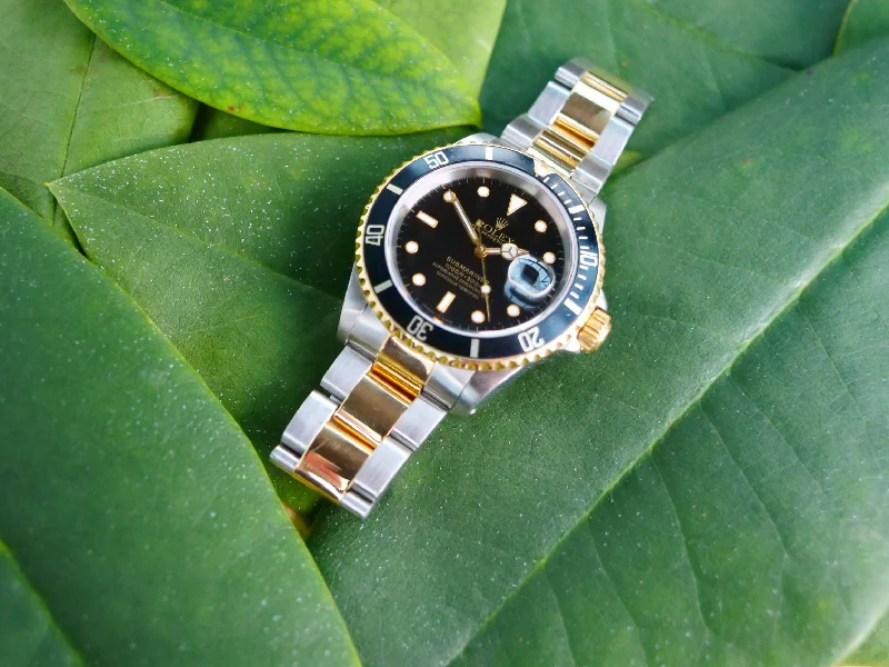 Rolex submariner 18ct Gold and steel with box and papers